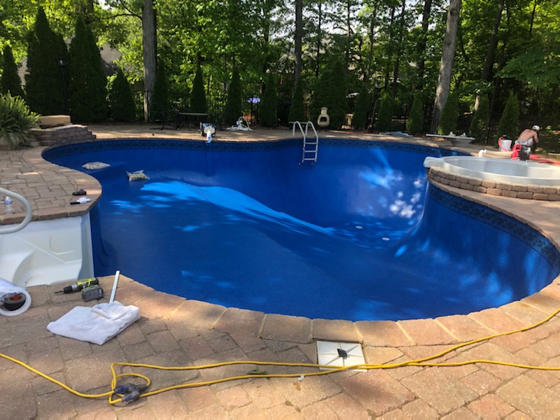 Clear H2O team member working on vinyl liner installation