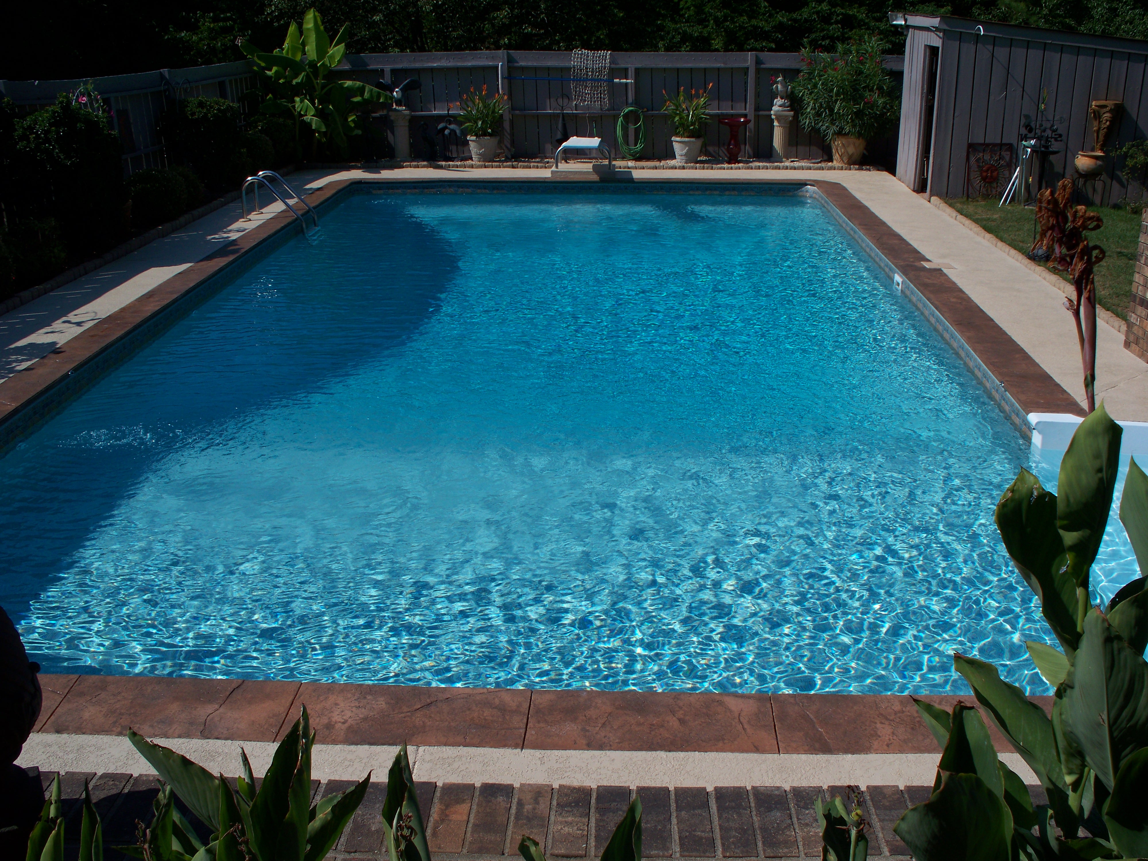 After: Yarborough pool with fresh bright blue vinyl liner